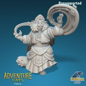 May include: A 3D-printed figurine of a cat character, Paltuun, from the Adventure Cats series. The cat is dressed in ornate robes and holds a curved staff and a circular object. The figurine is light gray and stands on a blue background. The text "Adventure Cats - Paltuun -" is visible.