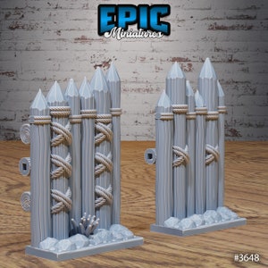 May include: A set of two gray plastic miniature wooden fence sections with rope details. The fence sections are designed for tabletop gaming and role-playing games.  #3648