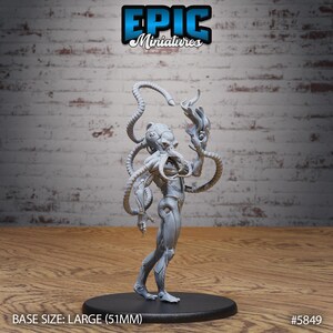 May include: A gray miniature alien figure with multiple tentacles and a detailed body, standing on a black base. The figure is holding a flame-like object in one hand. The base size is large (51mm). The Epic Miniatures logo is visible.