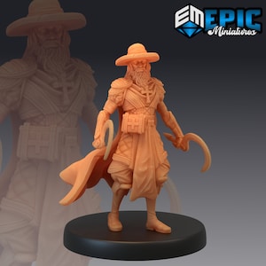 May include: A miniature figurine of a person wearing a wide-brimmed hat, a long robe, and holding two curved weapons. The figurine is painted in a light brown colour and is standing on a black base.