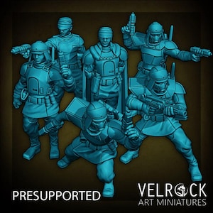 May include: A group of blue miniature figures in various action poses, holding weapons. The figures are wearing helmets and armor. The text "PRESUPPORTED" is at the bottom left, and "VELROCK ART MINIATURES" is at the bottom right.