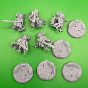 May include: Set of six grey plastic miniature figurines of mice wearing armour and holding swords, with six grey plastic bases.