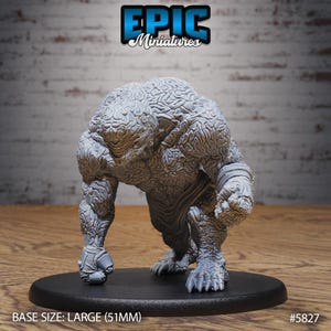 Könnte beinhalten: Graue Miniatur-Monsterfigur mit einer strukturierten, gehirnartigen Oberfläche. Die Figur befindet sich in einer geduckten Pose auf einer schwarzen Basis. Der Text "EPIC Miniatures" befindet sich oben. Die Basisgröße beträgt 5,1 cm.