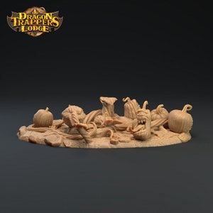 May include: A miniature tabletop gaming terrain piece depicting a patch of twisted vines and pumpkins, with one pumpkin having a toothy, gaping maw. The piece is made of brown resin and is designed for use in fantasy role-playing games.