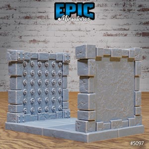 May include: A set of two gray stone dungeon wall sections for tabletop gaming. One section features a studded metal door, while the other is a plain wall. The set is labeled "EPIC Miniatures #5097".