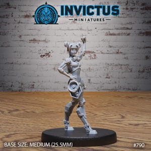 May include: A gray, detailed, plastic miniature of a female robot with a large speaker in her hand. The robot has a mechanical leg and is standing on a black base. The base is labeled "BASE SIZE: MEDIUM (25.5MM)" and "#790".