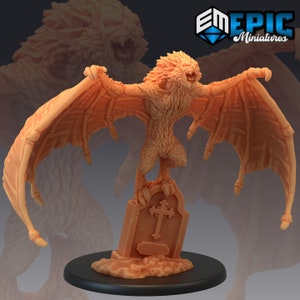 May include: A 3D printed miniature of a winged lion creature with a cross on a tombstone. The creature is standing on the tombstone with its wings spread out. The miniature is painted in a light brown colour.