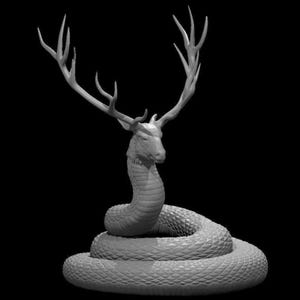 May include: A monochrome sculpture of a mythical creature, a hybrid of a deer and a snake. The deer head has large antlers, and the body is a coiled snake. The sculpture is set against a black background.