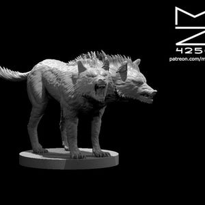 May include: A detailed, grayscale sculpture of a two-headed wolf-like creature. The sculpture is on a circular base, with the heads snarling and showing teeth. The background is black, and the image includes the text "MZ 4250" and a website address.