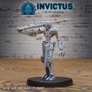 May include: A gray plastic miniature of a robot holding a large gun. The robot is standing on a round base. The base is labeled "BASE SIZE: MEDIUM (25.5MM)" and "#461".