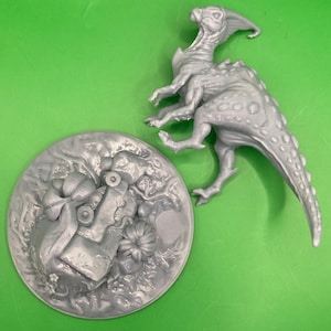 May include: A grey, 3D printed dinosaur figurine with a long tail and a textured body. The dinosaur is standing on a grey, 3D printed base with a textured surface.