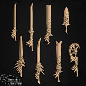 May include: A collection of eight gold-colored miniature fantasy swords and blades with ornate designs. The blades vary in shape and size, with curved and straight edges, and decorative handles. The background is a dark gray.