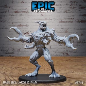 May include: A gray miniature figure of a monster with large claw-like hands, horns, and a menacing expression. The figure is on a black base. The text "EPIC Miniatures" is at the top. The base size is large (51mm).