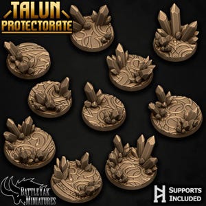 May include: A collection of brown miniature bases with crystal formations. Each base features a detailed, swirling pattern and is adorned with multiple crystal-like structures. The text "TALUN PROTECTORATE" and "SUPPORTS INCLUDED" are visible.