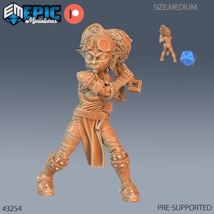 May include: A brown, pre-supported miniature of a female goblin warrior with a large hammer. She is wearing goggles and armor. The miniature is posed in a fighting stance. The miniature is labeled #3254 and is part of the Epic Miniatures line.