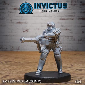 May include: A gray miniature figure of a soldier in futuristic armor, holding a large weapon. The figure is standing on a black base. The image includes the text "INVICTUS - MINIATURES" and "BASE SIZE: MEDIUM (25.5MM)".