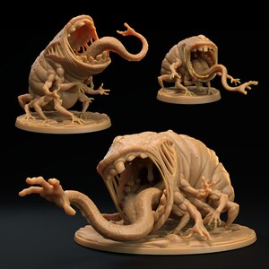 May include: A 3D printed miniature of a grotesque, fleshy creature with a gaping maw, multiple limbs, and a long, writhing tongue. The creature is posed in a predatory stance, with its mouth open wide and its tongue extended.