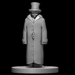 May include: A grey figurine of a person wearing a top hat and a long coat. The coat is open and the person's face is visible. The figurine is standing on a round base.