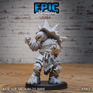 May include: A gray, detailed miniature of a turtle-like creature with a spiky shell, wearing a robe and holding a weapon. The miniature is standing on a black base.  BASE SIZE: MEDIUM (25.5MM) #3963