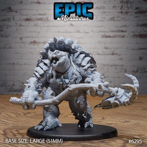 May include: A gray miniature figurine of a turtle-like creature with spiky armor, holding a wooden weapon. The base size is large, measuring 2 inches. The Epic Miniatures logo is visible.