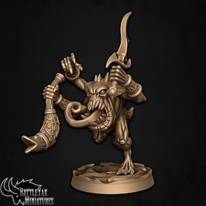May include: A bronze miniature figure of a monster with a large mouth, sharp teeth, and a long tongue. It holds a curved blade and a horn-shaped object. The figure is on a circular base, with the "BattleYak Miniatures" logo visible.