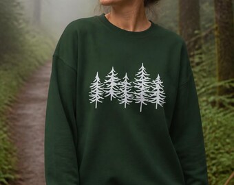 May include: A dark forest green crewneck sweatshirt featuring a white graphic print of a row of four stylized evergreen trees across the chest. The long-sleeved pullover has a ribbed neckline, cuffs, and hem, providing a clean, simple silhouette.