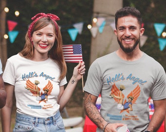 May include: Two people wearing grey and white t-shirts with a graphic of a woman in a blue and white outfit with the text "Hell's Angel" and "Warbird Elmira Girls".