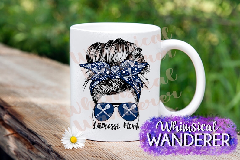 May include: White ceramic mug with a graphic of a woman with a messy bun wearing a blue and white bandana with lacrosse sticks printed on it. The bandana is tied around her bun. She is wearing sunglasses with lacrosse sticks printed on the lenses. The text "Lacrosse Mom" is printed below the graphic.