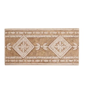May include: A rectangular decorative tile with a beige and cream color scheme. The tile features a repeating pattern of diamond shapes with floral designs, connected by a rope-like border and small circular accents. The tile measures approximately 10 inches in length.