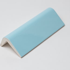 May include: A light blue ceramic corner tile with a smooth, glossy finish.