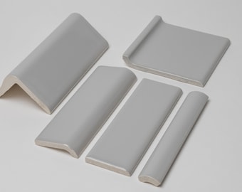 Remate en V de cerámica gris brillante, remate de lodo, borde redondeado, cuarto de círculo y base cóncava