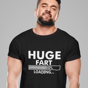 May include: A black t-shirt with a white graphic that reads "HUGE FART" with a progress bar that says "60% LOADING..."