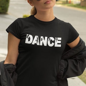 May include: A black t-shirt with the word "DANCE" printed in white. The word is made up of silhouettes of dancers in different poses.