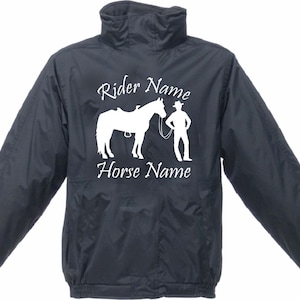 May include: Dark navy jacket featuring a white graphic of a horse, rider, and text reading "Rider Name" and "Horse Name". The jacket has a high collar and long sleeves.