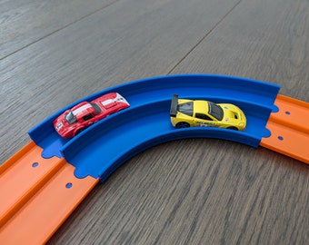 Pista de doble carril Hot Wheels con curva de 90 grados