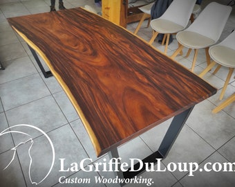 Live-edge "Sinueux" Suar wood dining table.