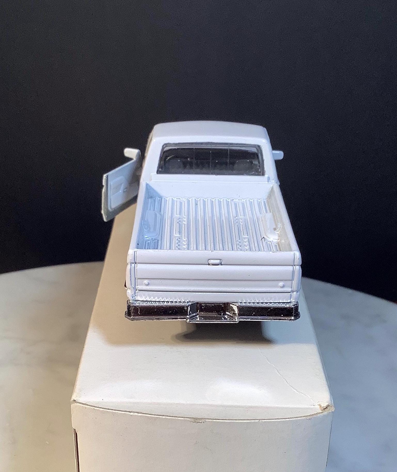 White Die-cast Scale Model of a Ford F-150 Pickup Truck, Made by Maisto ...