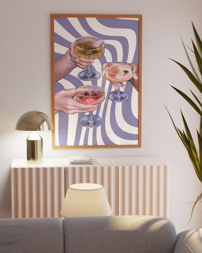 May include: A framed print with a purple and white wavy background. Four hands are holding up glasses of wine, each with a different colored liquid.