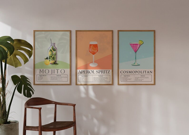 May include: Three framed illustrations of popular cocktails: a Mojito, Aperol Spritz, and Cosmopolitan. Each illustration features a colorful depiction of the drink and includes a list of ingredients and instructions.