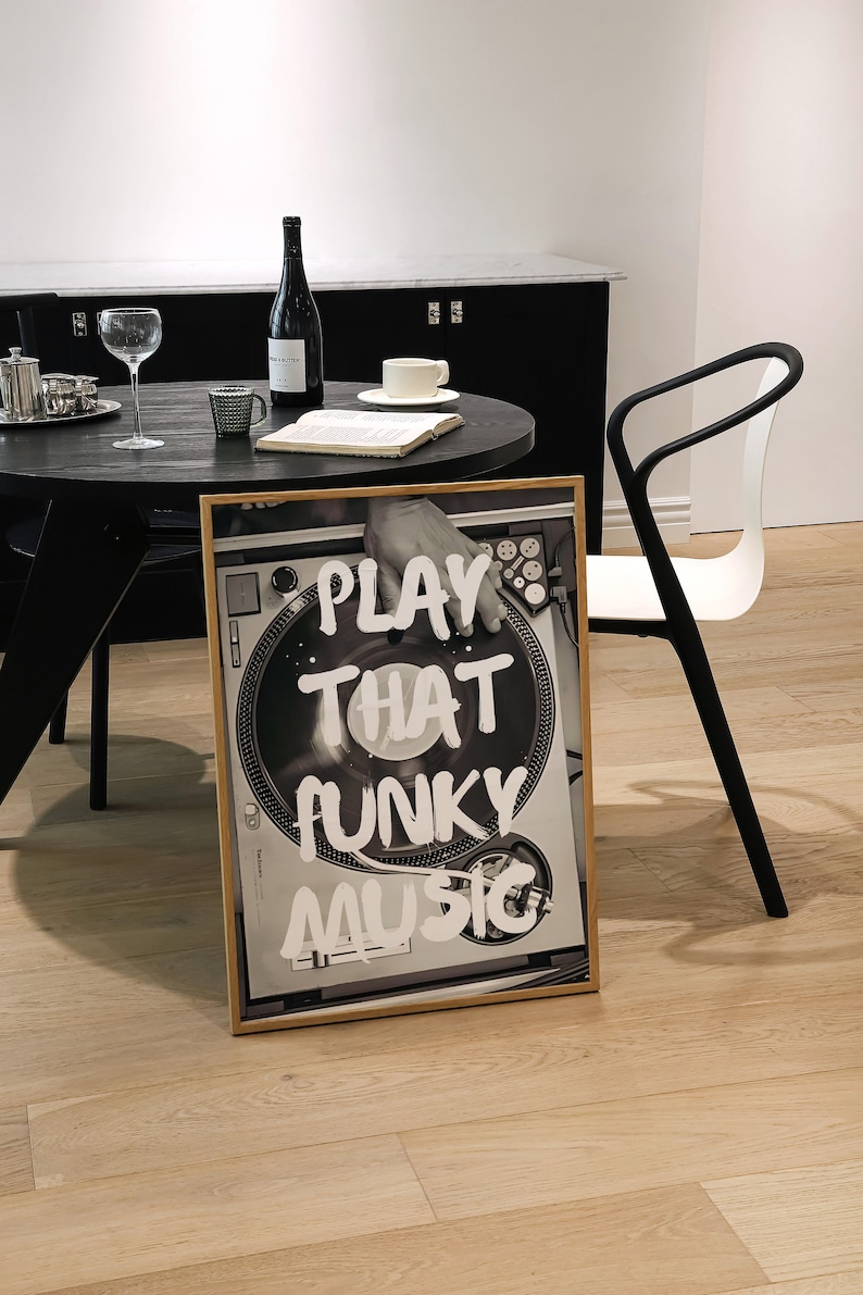 May include: A framed black and white photograph of a turntable with the text "PLAY THAT FUNKY MUSIC" written in white paint.
