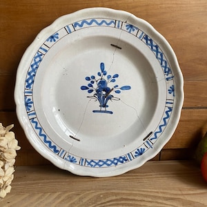 May include: A set of three ceramic mugs with a speckled, matte finish in cream, light brown, and dark brown. Each mug has a simple, minimalist design and a rounded handle. The mugs are stacked on top of each other.