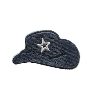 May include: A blue denim cowboy hat with a white star embroidered on the front. The hat is a patch that can be ironed onto clothing or fabric.