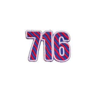 May include: Embroidered patch featuring the number "716" in a bold, stylized design. The numbers are blue with red diagonal stripes and white trim, perfect for adding to clothing or accessories.