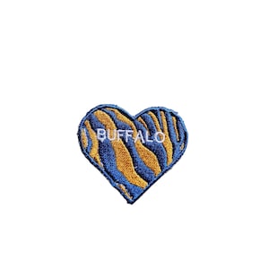 May include: A blue and gold heart-shaped patch with the word "BUFFALO" embroidered in white.