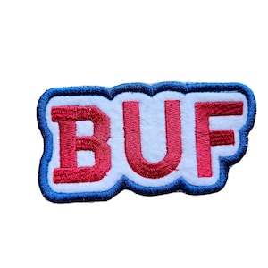 May include: An embroidered patch in blue and white with the word "BUF" in red lettering.