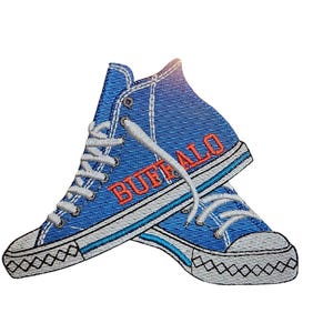 May include: Blue and white embroidered patch of a pair of high-top sneakers with the word "BUFFALO" stitched in orange on the side.