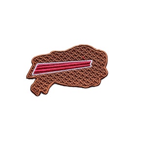May include: A brown embroidered patch with a red and white stripe across the center. The patch is shaped like a cloud.