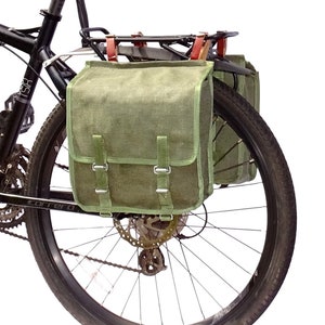 A Pair Of 1980s Ex-Army Showerproof Canvas Pannier Bags With Leather Straps vintage green large bike panniers rainproof NOS