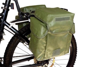A pair of ex-army pannier bags in olive green large fully waterproof vintage ex-army big bicycle panniers