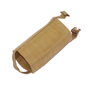 May include: Tan canvas cylindrical case with a loop and strap closures. The case has a textured surface and appears to be made of durable material. The case is designed to hold a cylindrical object.